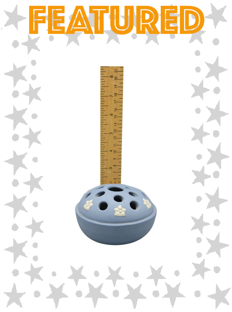 Blue with white flower motifs and holes for flower stems to be inserted to water bowl base.