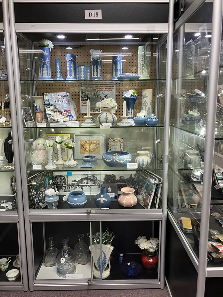 D-18 display Case of 4 shelves of premium pottery items